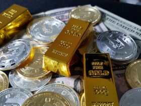 Gold bars and coins representing gold investment rates in India for 24K and 22K gold